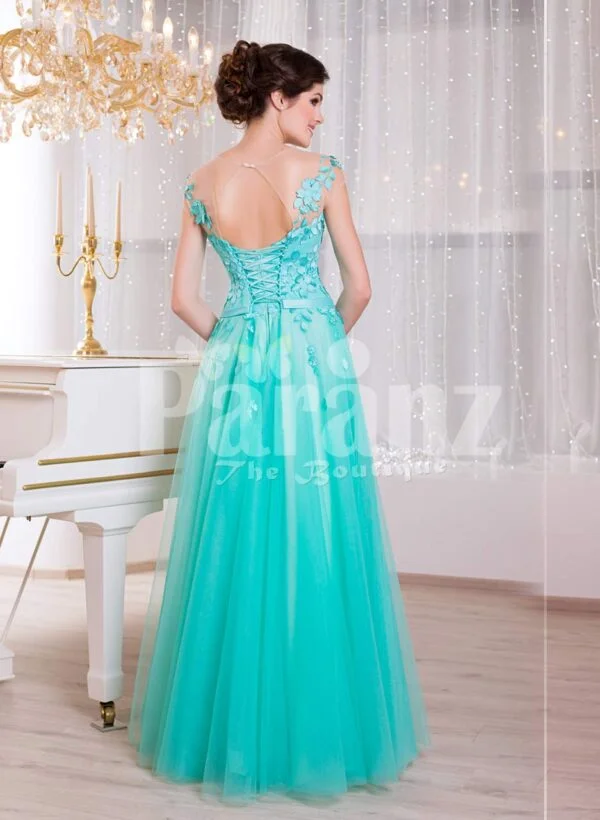 Women’s floor length elegant evening gown with mint tulle skirt and floral appliquéd bodice back side view