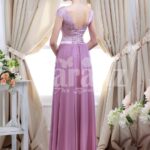 Women’s light metal pink bodice evening gown with rich mauve long tulle skirt back side view