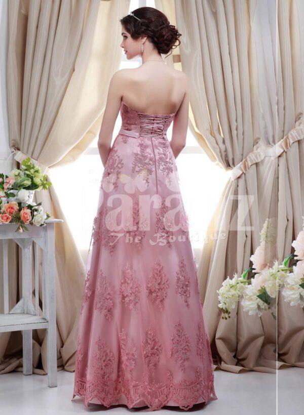 Women’s metallic pink off-shoulder evening party gown with floor length lace work skirt back side view