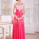 Women’s pink evening gown with white floral appliquéd bodice and sleek tulle skirt