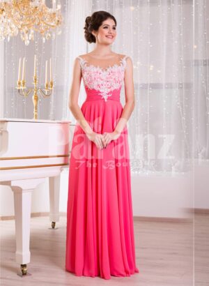Women’s pink evening gown with white floral appliquéd bodice and sleek tulle skirt