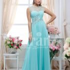 Women’s sleeveless crepe-rhinestone bodice glam evening gown with long mint tulle skirt