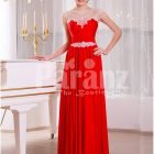 Women’s vibrant red sleeveless evening gown with sleek and long floor length tulle skirt