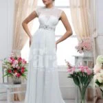 Women’s white floor length royal evening party gown with rich rhinestone work neckline