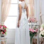 Women’s white floor length royal evening party gown with rich rhinestone work neckline side view