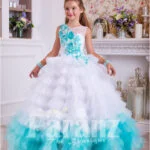 A long formal dress for little girls in white and coral green