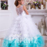 A long formal dress for little girls in white and coral green side view