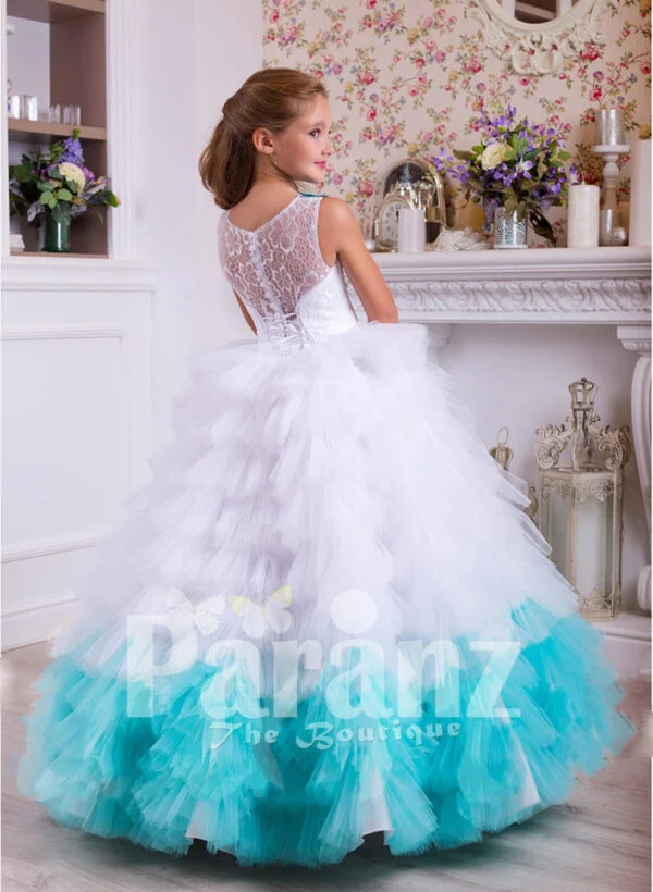 A long formal dress for little girls in white and coral green side view