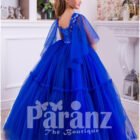 A superbly designed long formal dress for little girls in striking blue back side view