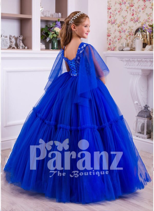 A superbly designed long formal dress for little girls in striking blue back side view