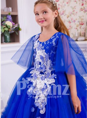 A superbly designed long formal dress for little girls in striking blue side view