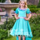 A touch of royalty for your little princess with this exotic blue formal dress